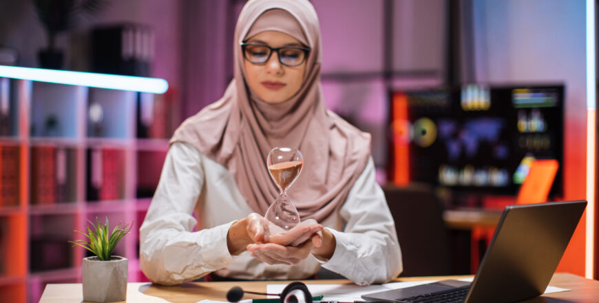 smiling-confident-businesswoman-in-hijab-sitting-a-2023-11-27-04-59-09-utc.jpg